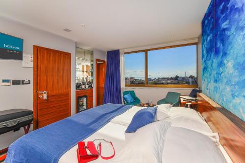 Letto o letti in una camera di Horizon Luxury Suites & Design Rooms