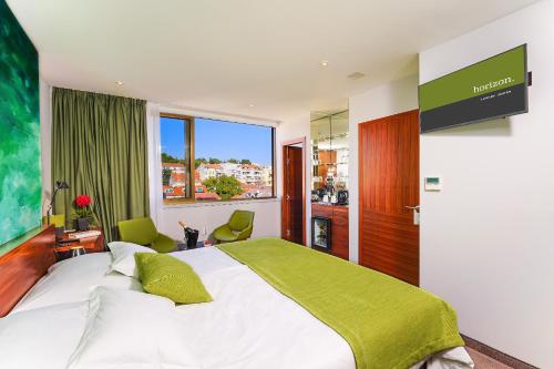 Letto o letti in una camera di Horizon Luxury Suites & Design Rooms