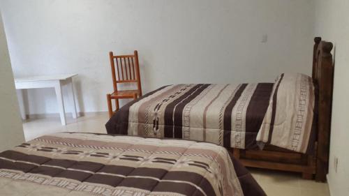 Cama o camas de una habitación en Hotel Posada Yauhtli