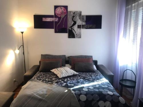 Postel nebo postele na pokoji v ubytování Bouganvillea - mare e tranquillità