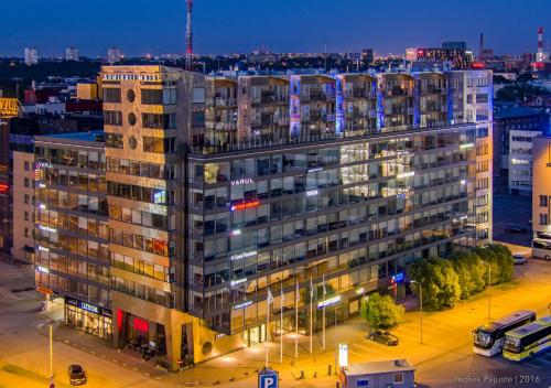 a large building in a city at night at AirHome - The Admiral House in Tallinn