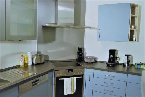 a kitchen with a sink and a stove top oven at Hildastraße 1 appart.2 in Friesenheim