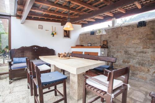 a dining room with a table and chairs at Beautiful Country House&Romantic Garden in Sintra