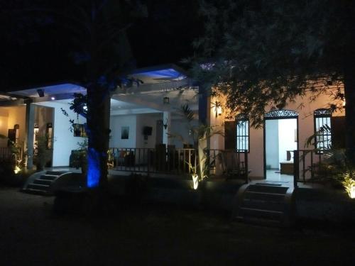 a house at night with a blue light at Ging View Villa in Galle
