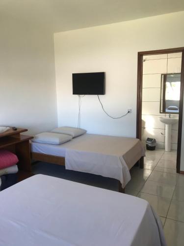 Postel nebo postele na pokoji v ubytování Apart Hotel Alegrete