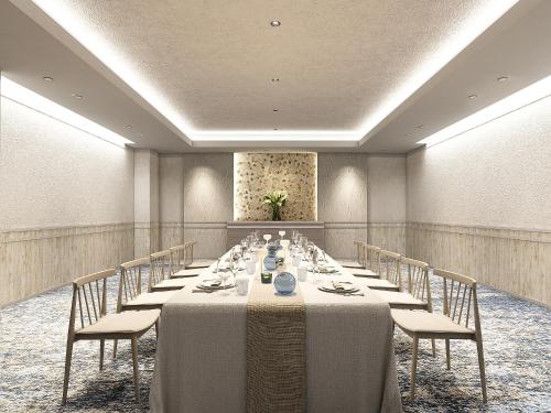 a conference room with a long table and chairs at Oriental Hotel Fukuoka Hakata Station in Fukuoka