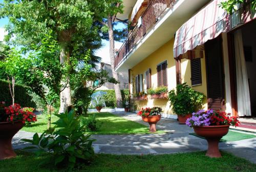 a house with flower pots on the side of it at Bed&Breakfast Villa Lorena in Forte dei Marmi