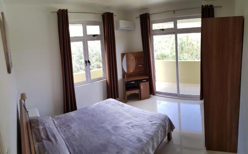 Ένα ή περισσότερα κρεβάτια σε δωμάτιο στο Colosseo Apartments