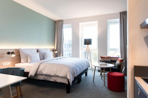Postel nebo postele na pokoji v ubytování sylc. Apartmenthotel – Serviced Apartments