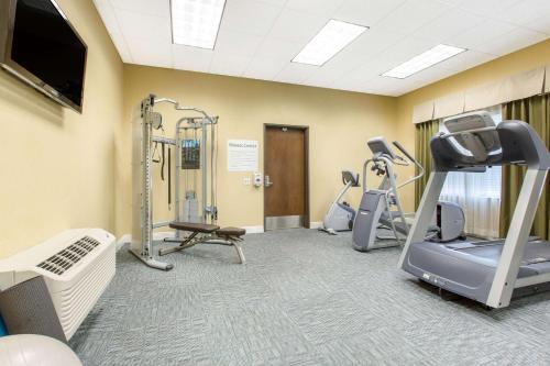a fitness room with treadmills and cardio equipment at The Oaks Hotel & Suites in Paso Robles
