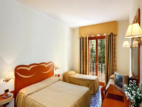 Postel nebo postele na pokoji v ubytování Hotel Albatros