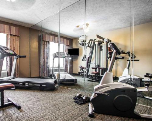 a gym with tread machines and a mirror at Quality Inn Florence East in Florence