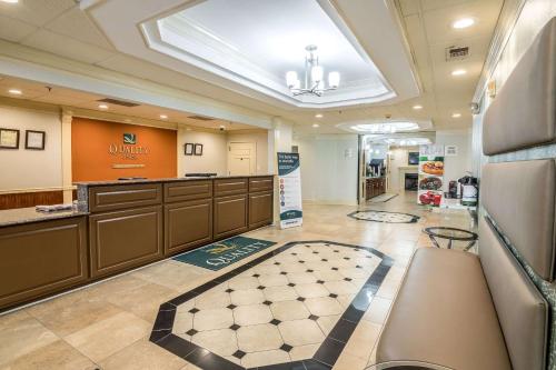 a large lobby with a waiting room with a pharmacy at Quality Inn Alexander City in Alexander City