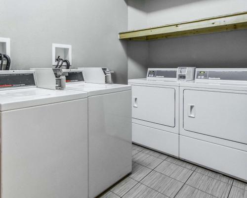 a room with four washing machines in a room at Econo Lodge Inn & Suites Enterprise in Enterprise