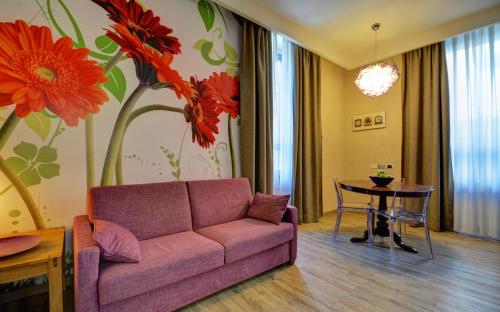 a living room with a couch and a table at Residence Star in Turin