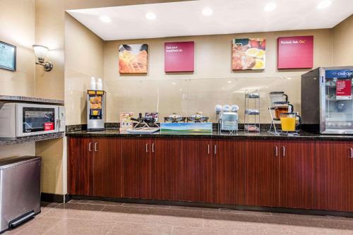 a kitchen with a counter with a coffee maker at Comfort Suites Tuscaloosa near University in Tuscaloosa