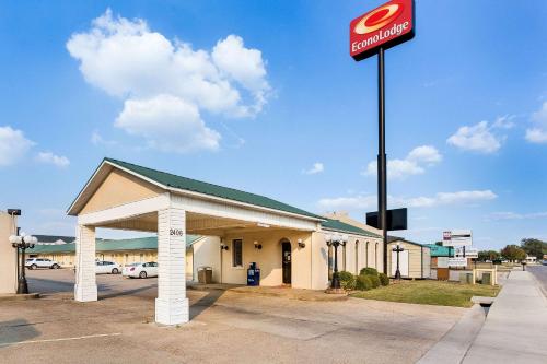 a mobil gas station with a sign in front of it at Econo Lodge Jonesboro in Jonesboro