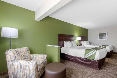 Ένα ή περισσότερα κρεβάτια σε δωμάτιο στο Quality Inn & Suites Mountain Home North