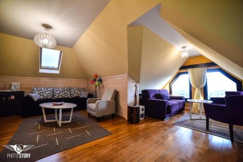 a living room with a couch and a table at Vila Breg Zlatibor in Zlatibor