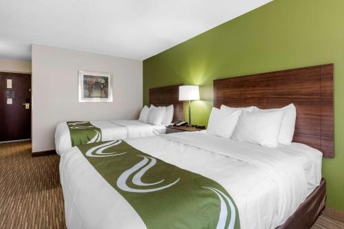 Ένα ή περισσότερα κρεβάτια σε δωμάτιο στο Quality Inn & Suites Mountain Home North