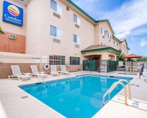 a hotel with a swimming pool in front of a building at Comfort Inn & Suites Sierra Vista near Ft Huachuca in Sierra Vista