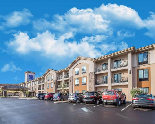 a building with cars parked in a parking lot at Sleep Inn & Suites Page at Lake Powell in Page