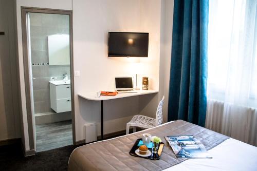 Ένα ή περισσότερα κρεβάτια σε δωμάτιο στο Hotel De La Pommeraie