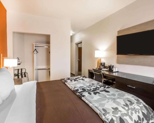 a hotel room with a bed and a desk at Sleep Inn & Suites Page at Lake Powell in Page