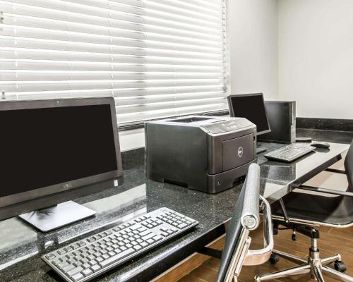 an office with a desk with a computer and a printer at Sleep Inn & Suites Page at Lake Powell in Page