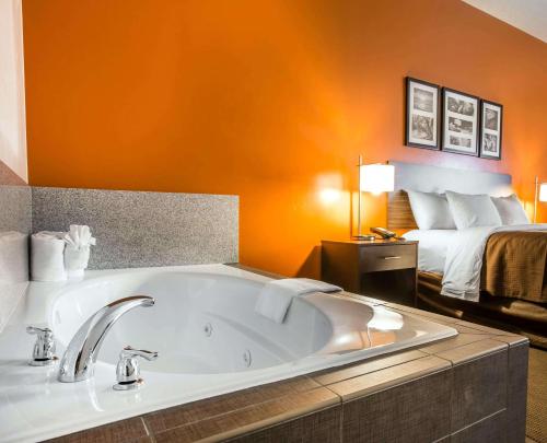 a large bath tub in a room with a bed at Sleep Inn & Suites Page at Lake Powell in Page