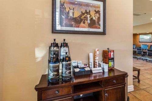 a table with bottles of beer on a wall at Quality Inn Casa Grande I-10 in Casa Grande