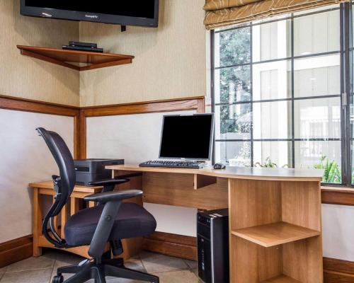an office with a desk with a computer and a chair at Quality Inn Petaluma - Sonoma in Petaluma