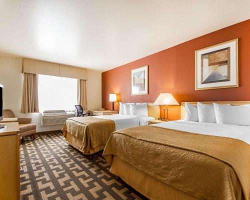 a hotel room with two beds and a television at Quality Inn Petaluma - Sonoma in Petaluma