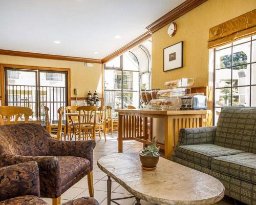 a living room with a couch and a table at Quality Inn Petaluma - Sonoma in Petaluma