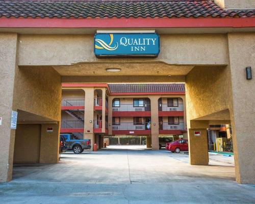 an empty parking lot in front of an apartment building at Quality Inn Downey in Downey
