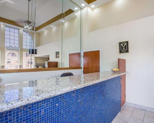 a swimming pool bar with a blue tile counter at Rodeway Inn Delano in Delano