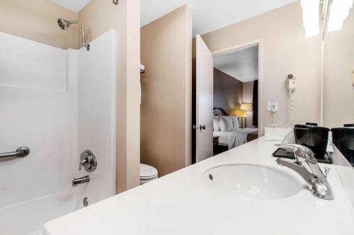 a white bathroom with a sink and a toilet at BaySide Inn & Suites Eureka in Eureka