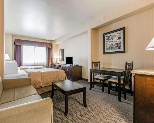 a hotel room with a bed and a desk at Quality Inn Rosemead-Los Angeles in Rosemead