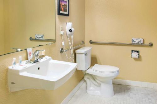 a bathroom with a white toilet and a sink at Comfort Inn & Suites San Francisco Airport North in South San Francisco