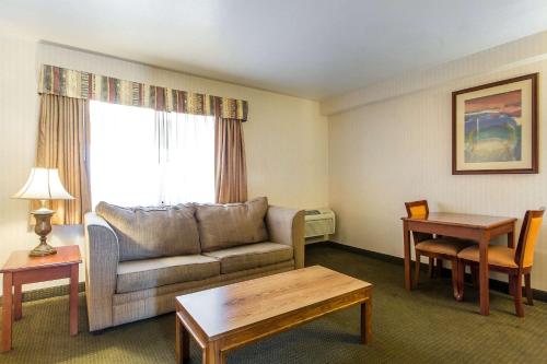 a living room with a couch and a table at Econo Lodge Inn & Suites Riverside - Corona in Riverside