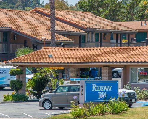 a truck parked in a parking lot in front of a house at Rodeway Inn Fallbrook Downtown in Fallbrook