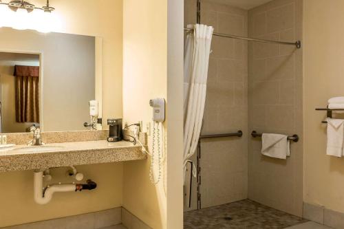 a bathroom with a sink and a shower at Quality Inn Lake Elsinore in Lake Elsinore