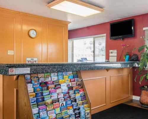 a kitchen with a counter with a wall covered in magnets at Rodeway Inn Fallbrook Downtown in Fallbrook