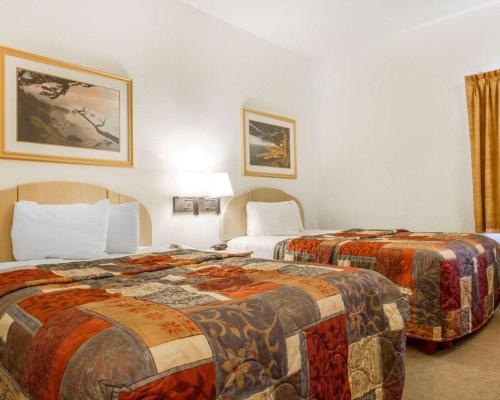 a hotel room with two beds in a room at Pacific Coast Inn in Watsonville