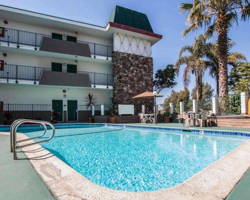 a swimming pool in front of a hotel at Rodeway Inn Oceanside Marina in Oceanside