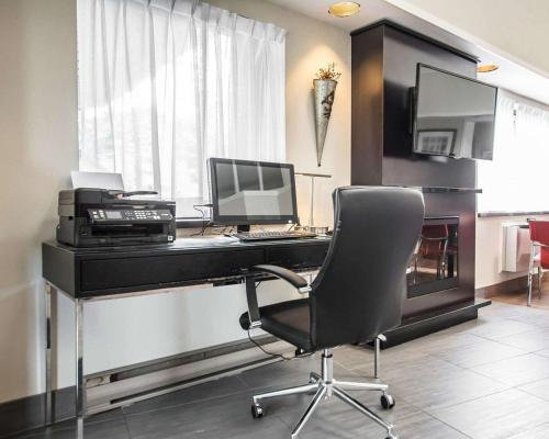 an office with a desk with a computer and a chair at Comfort Inn in Campbellton