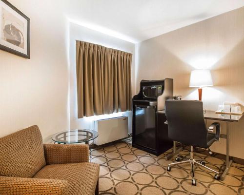 a living room filled with furniture and a tv at Comfort Inn Edmundston in Edmundston