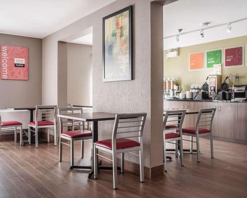 a dining room with a table and chairs at Comfort Inn in Orillia