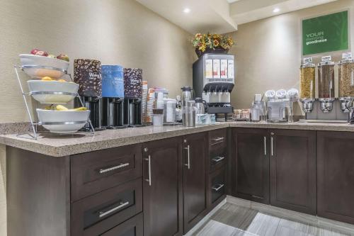 a pharmacyacist with a counter with a bunch of products at Comfort Inn Trenton in Trenton