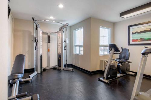 a gym with treadmills and exercise bikes in a room at Sleep Inn in Sault Ste. Marie